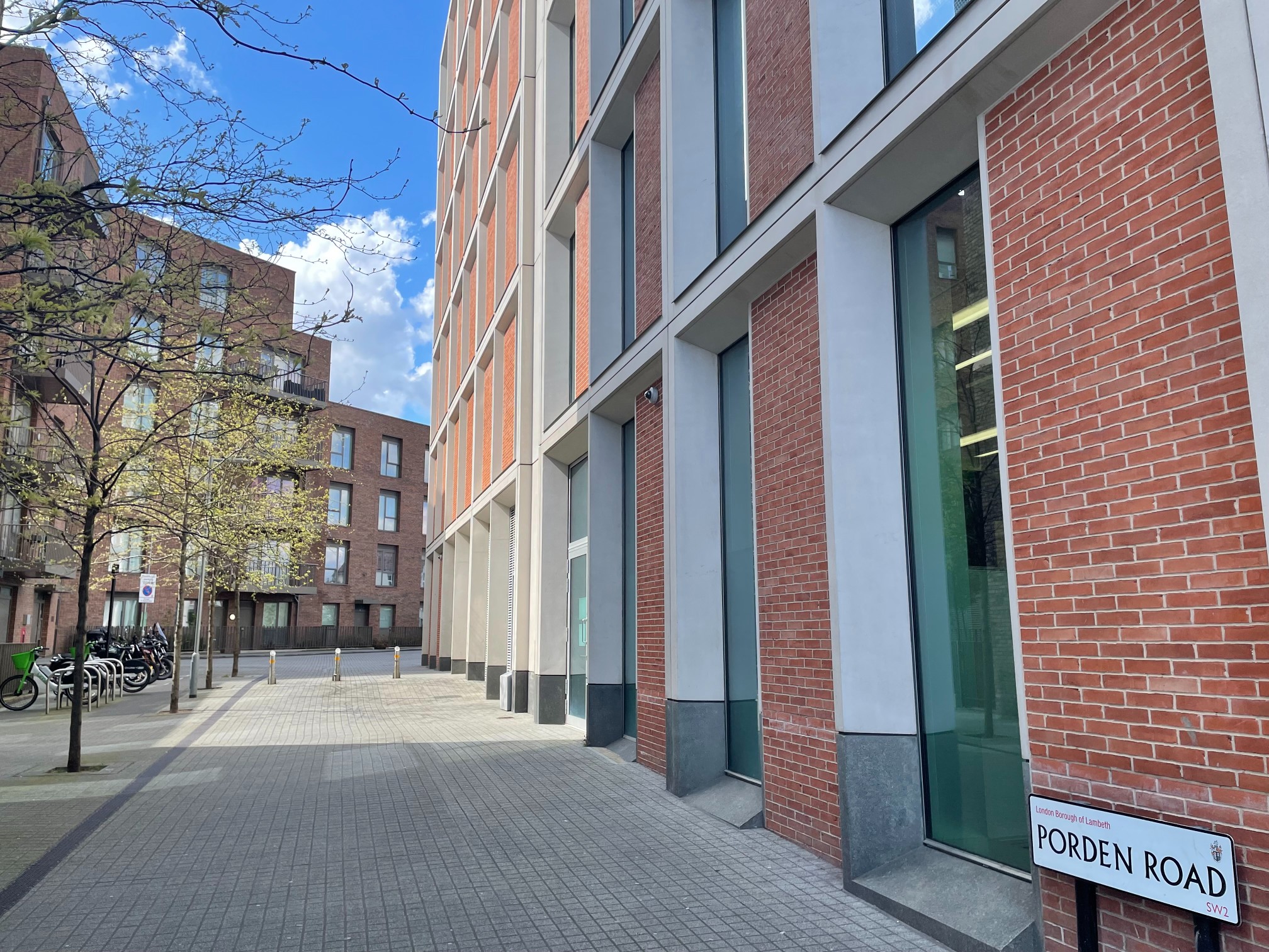 View of Porden Road with modern brick buildings in Lambeth, London taken from the side of the building.