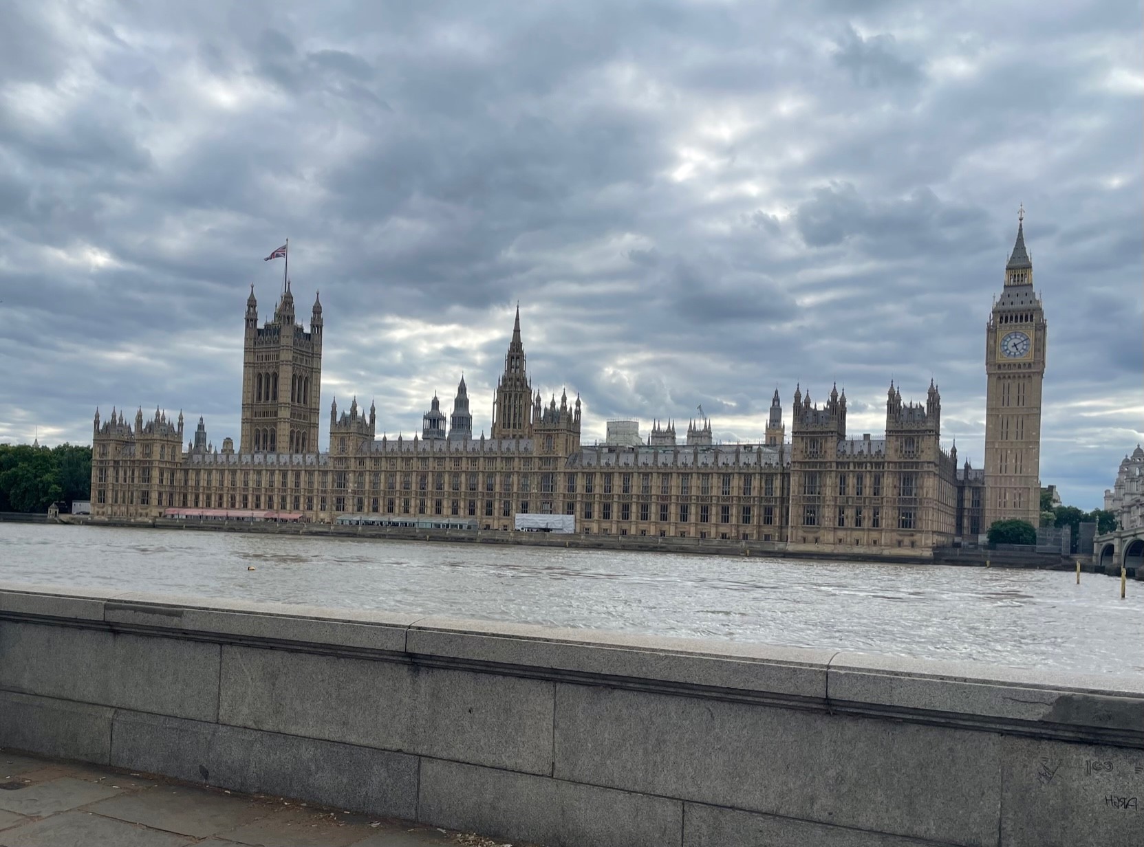 View of the Palace of Westminster and Big Ben from across the Thames River on Albert Embankment, London.